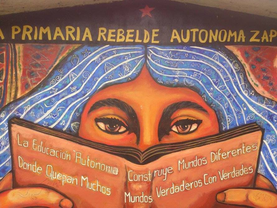 "Build different worlds where many worlds fit" mural of the Zapatista autonomous rebel elementary school in Oventic, Chiapas.