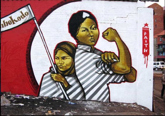 Graffiti-Art-by-Faith47-You-Strike-a-Woman-You-Strike-a-Rock